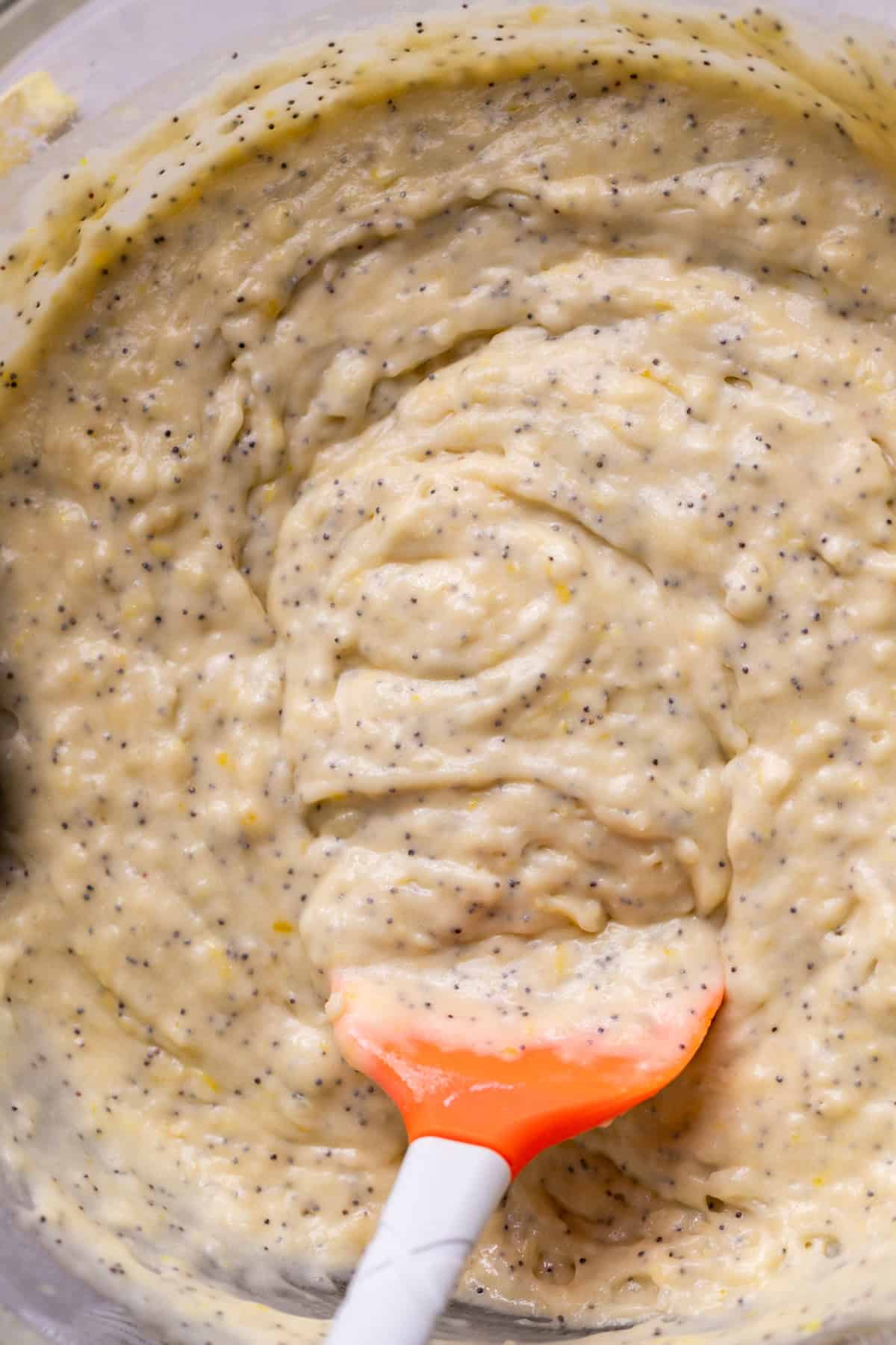 Muffin batter in a glass bowl.