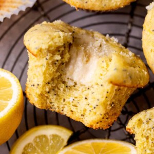 Bite missing from lemon cream cheese muffins.