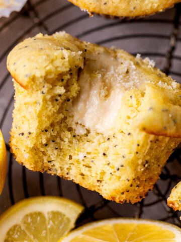 Bite missing from lemon cream cheese muffins.