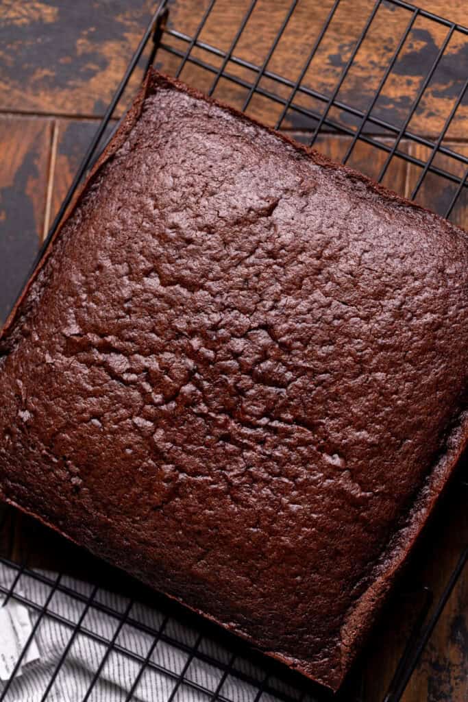 Baked cake on a wire rack.