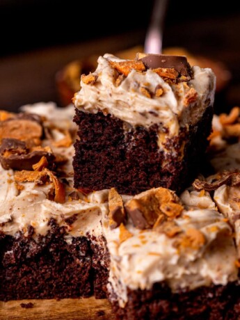 Stack of two butterfinger cake slices.