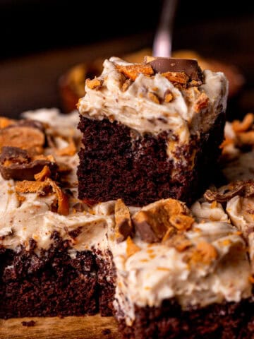 Stack of two butterfinger cake slices.