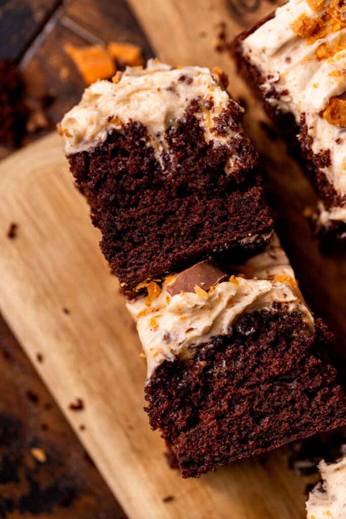 Two pieces of butterfinger cake on their side.