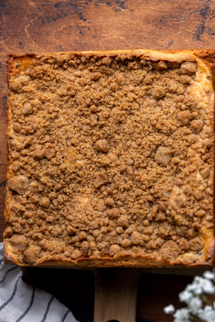 Baked cake on a wood board.