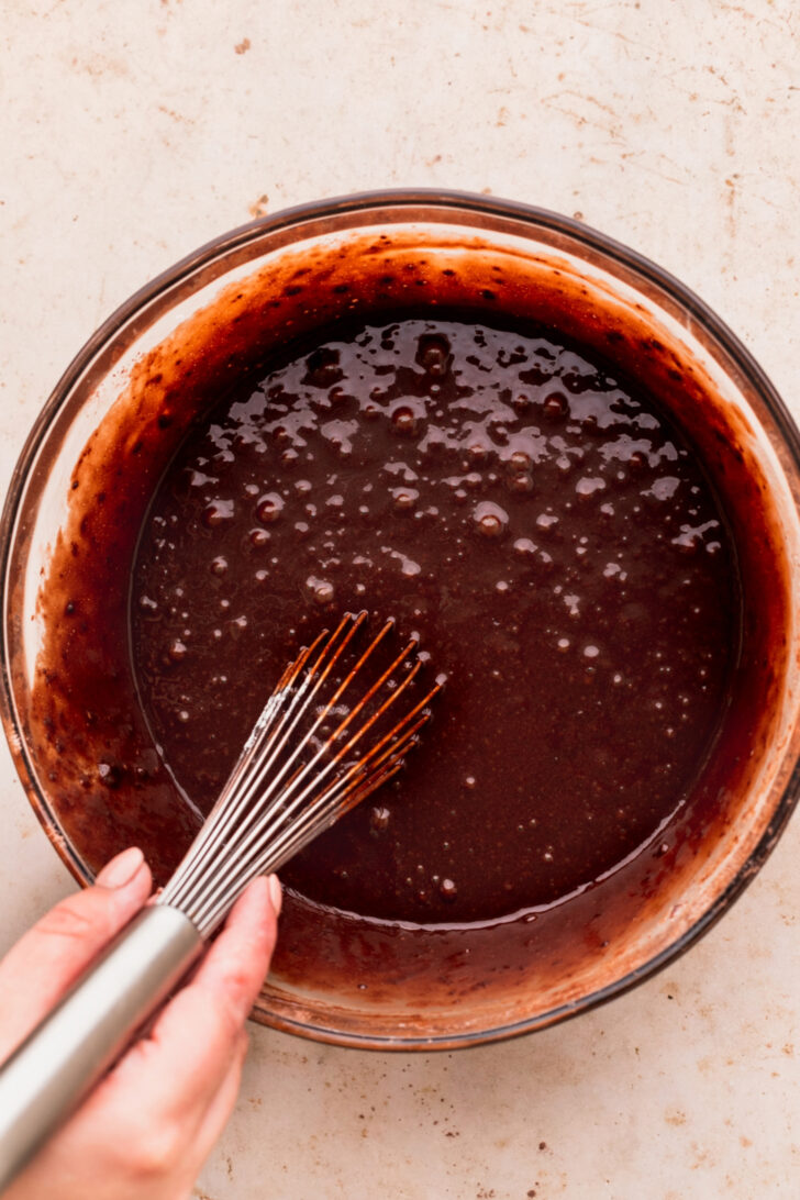 Chocolate cake batter in a bowl.