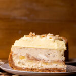 One slice of banana pudding cheesecake on a plate.