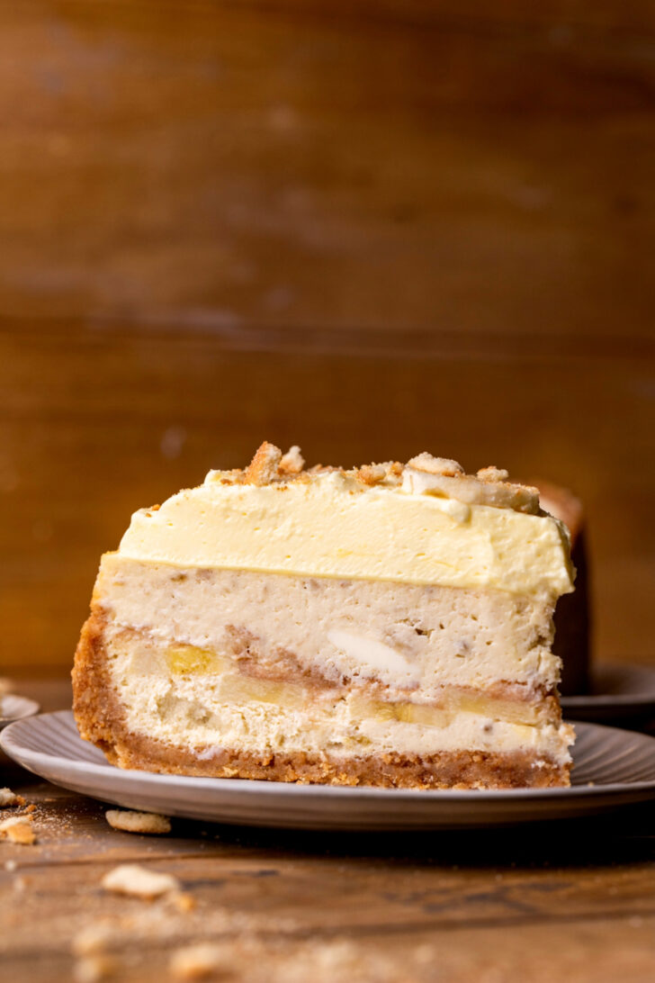 One slice of banana pudding cheesecake on a plate.