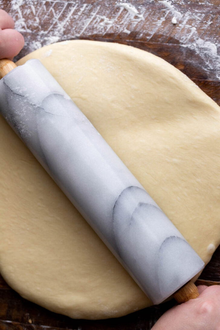 Rolling out the dough.