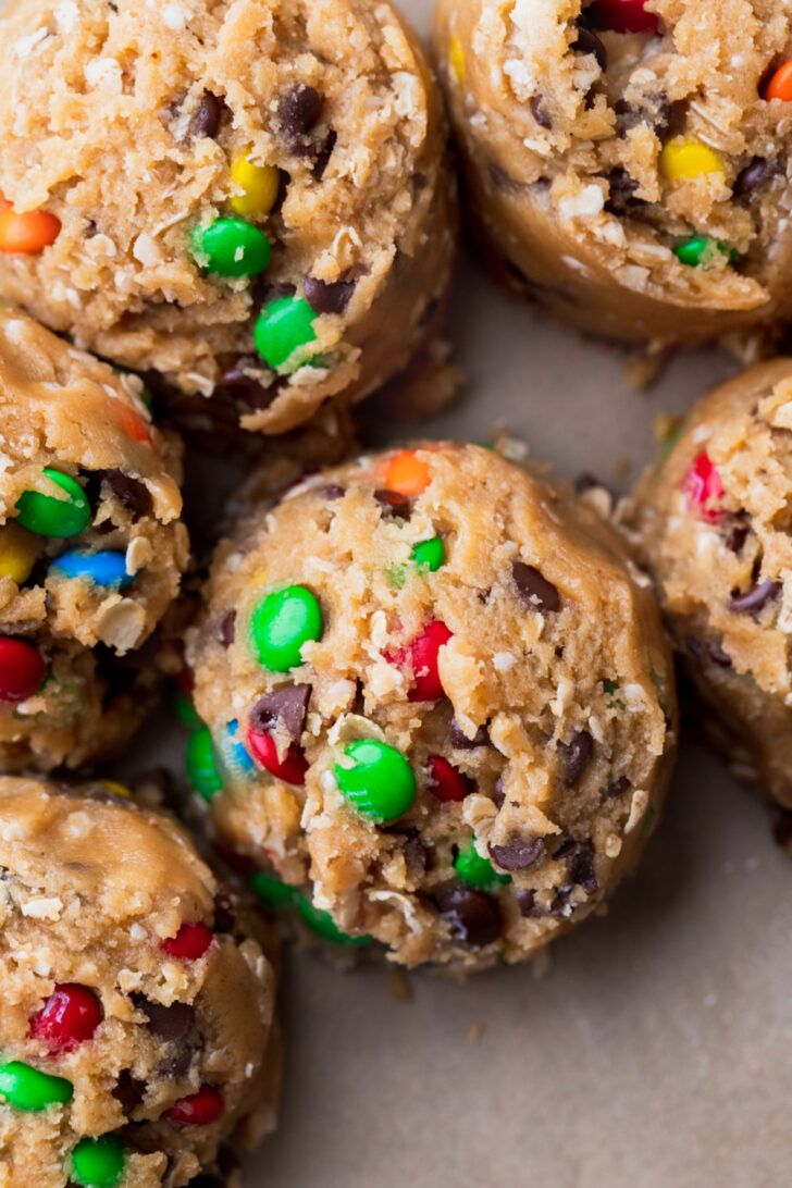 Cookie dough balls on parchment paper.