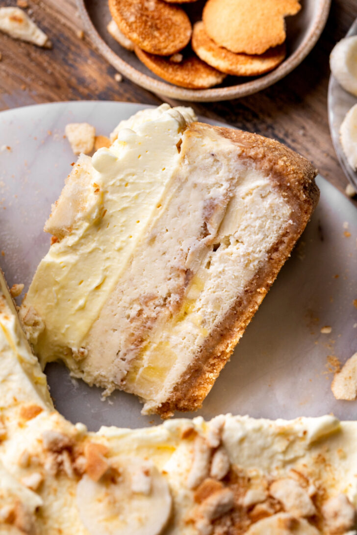 One slice on banana pudding cheesecake on its side.
