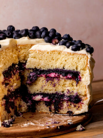 Taking a slice out of the blueberry jam cake.