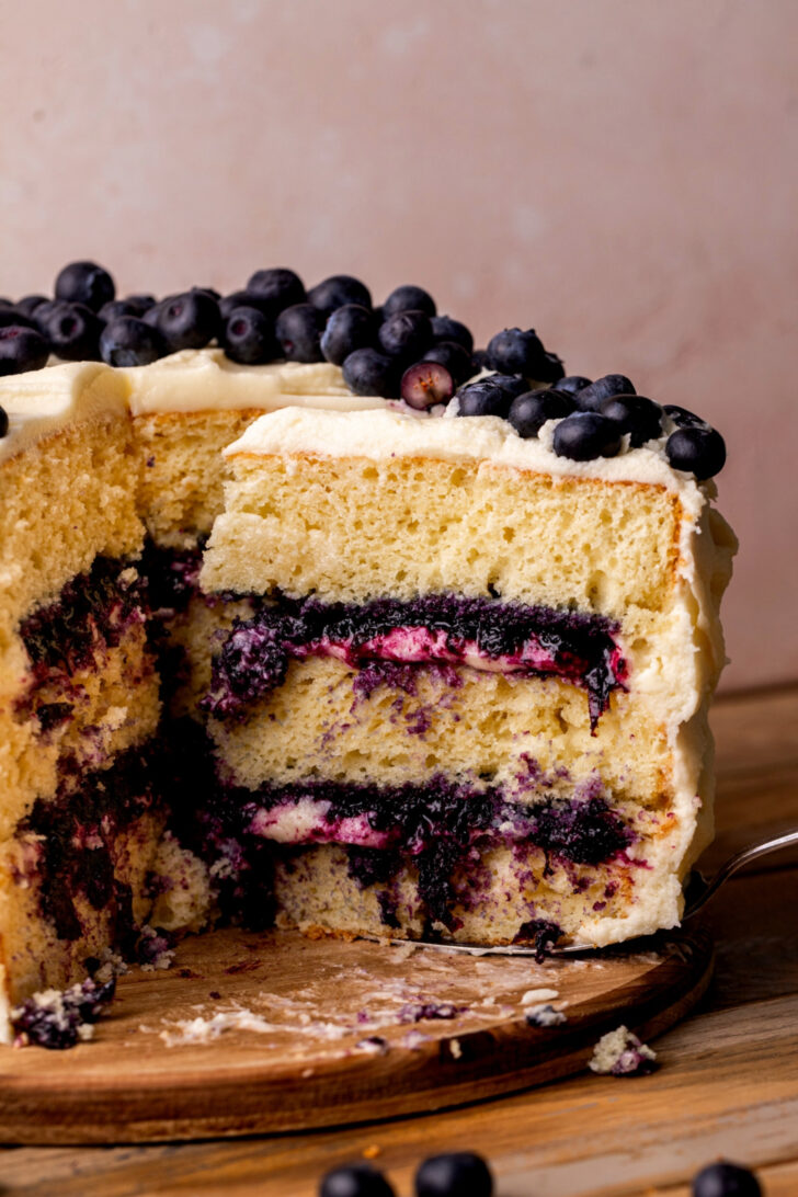 Taking a slice out of the blueberry jam cake.
