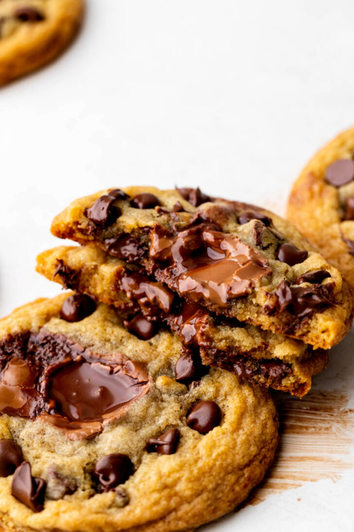 One lindt stuffed cookie split in half to show the inside.