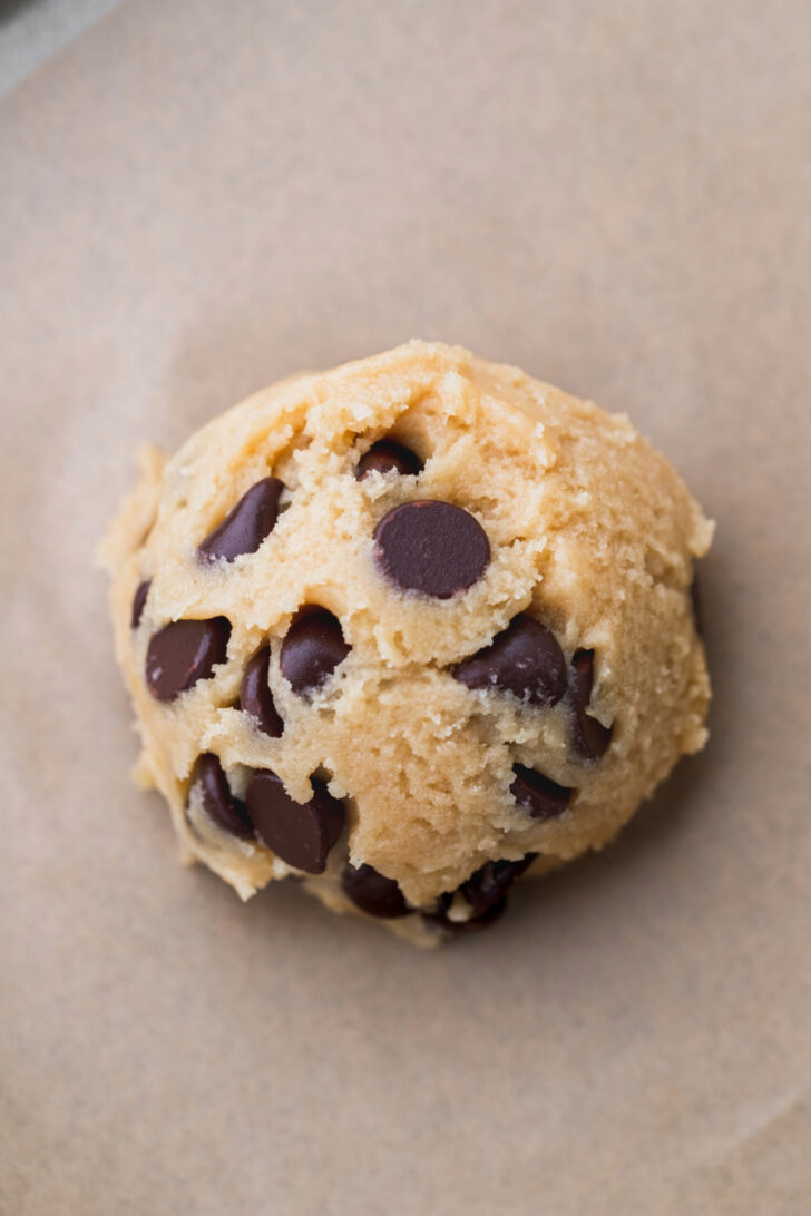 Cookie dough on parchment paper.