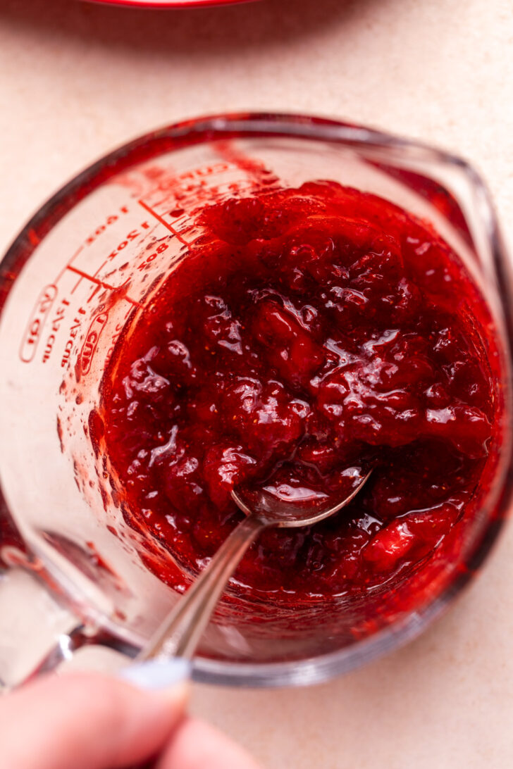 Strawberry jam in a glass bowl.