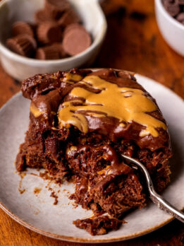 Fork inserted into one chocolate peanut butter rolls.