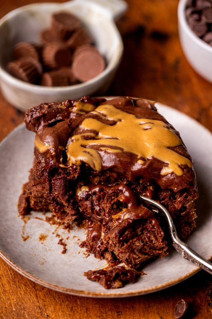 Fork inserted into one chocolate peanut butter rolls.