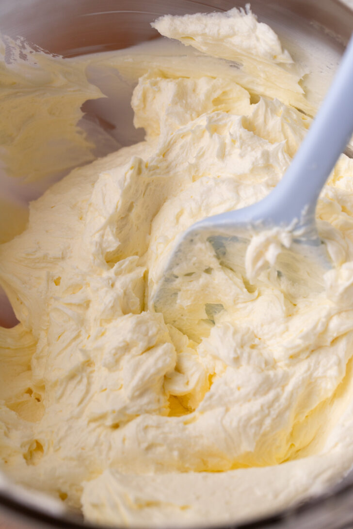 Whipped butter and cream cheese in a glass bowl.