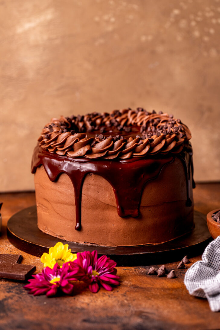 Decorated cake on a wood board.