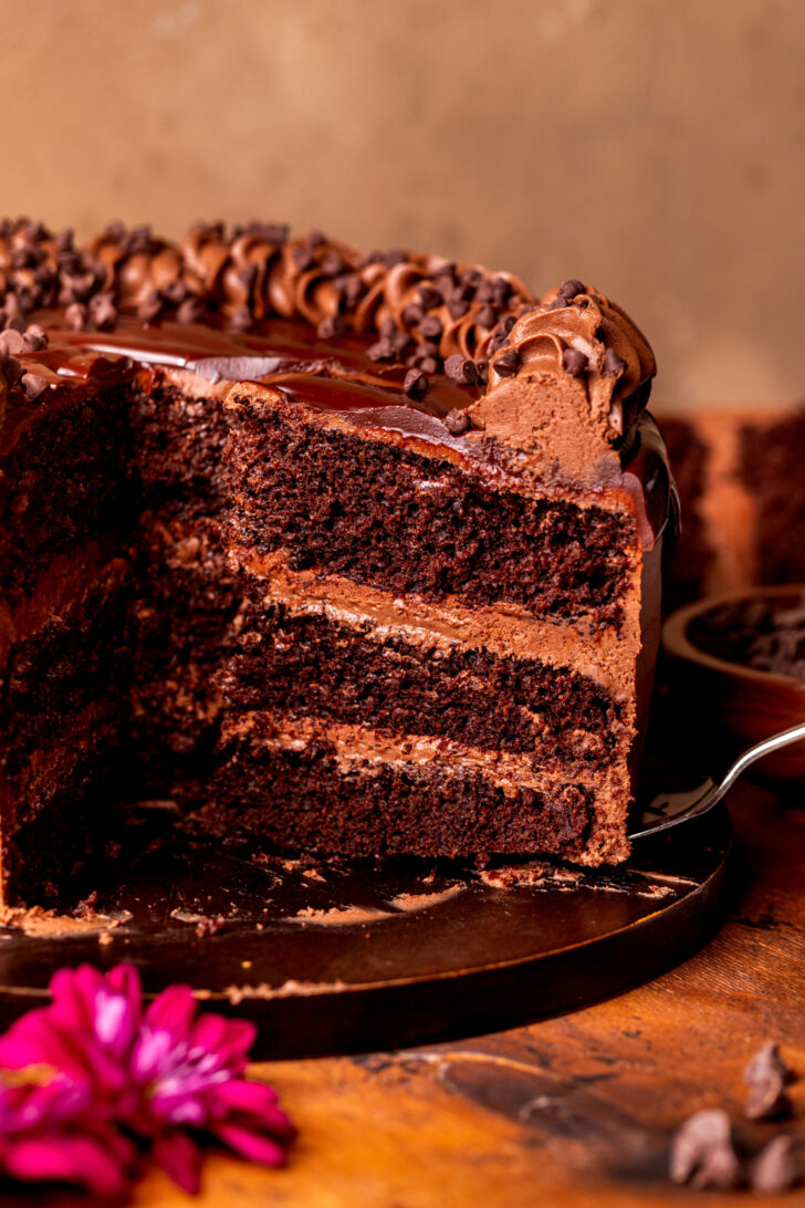 Taking a slice out of the triple chocolate cake.