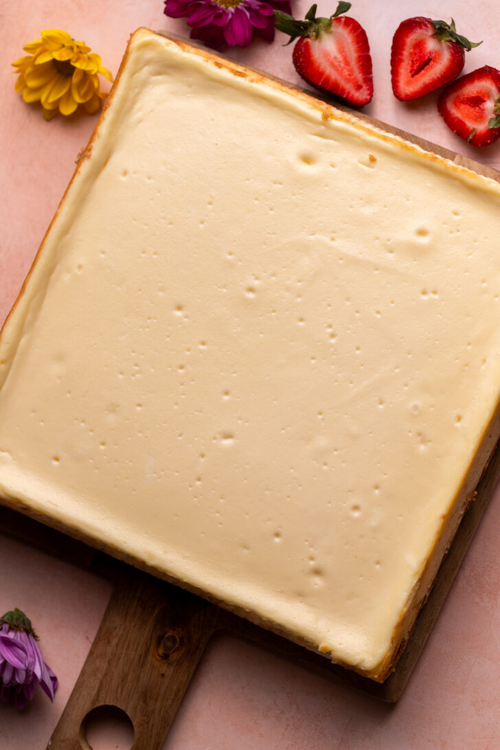 Baked cheesecake on a platter.