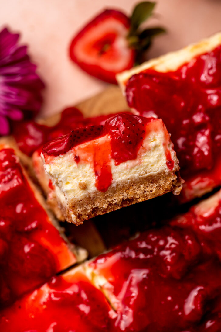 One piece of strawberry cheesecake bar on its side.