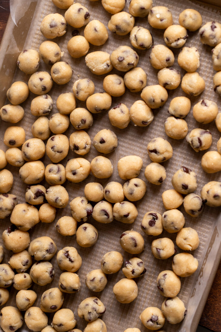 Cookie dough balls on a cookie sheet.