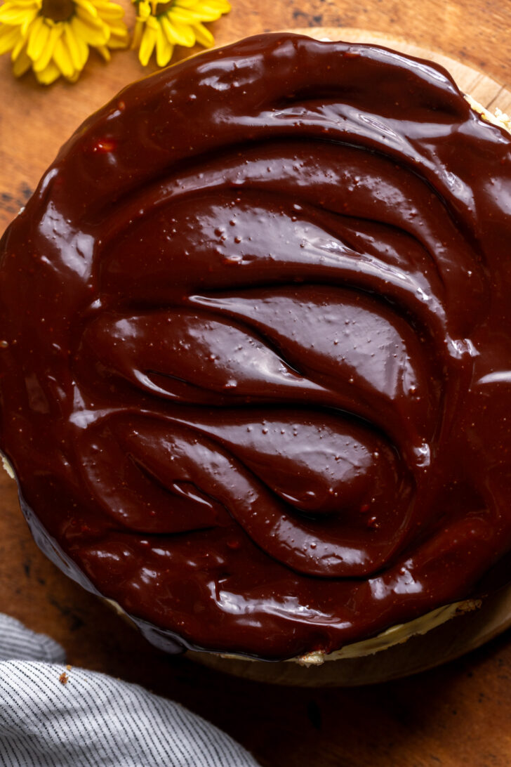 Chocolate ganache on top of cheesecake.