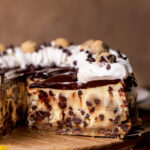Side view of cookie dough cheesecake slice.