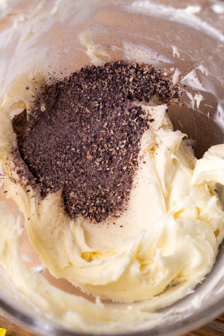 Frosting with grounded freeze dried blueberries on top.
