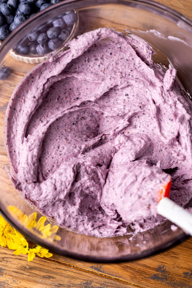 Blueberry frosting in a bowl.
