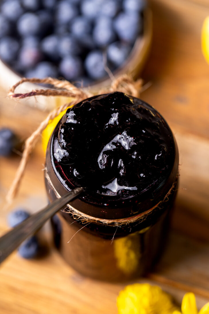 Close up of the top of the blueberry jam in a jar.