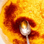 Spoon inserted into brown butter.