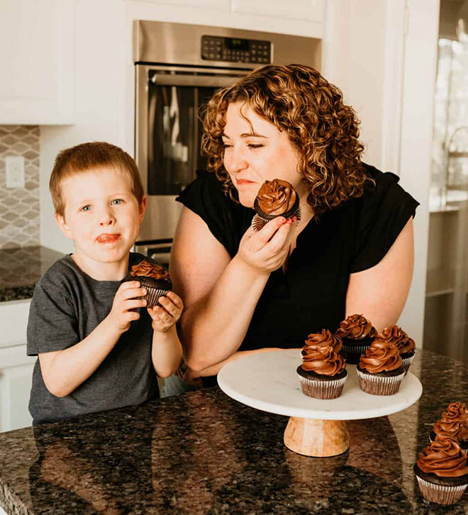 Stephanie and Henry eating cupcakes.