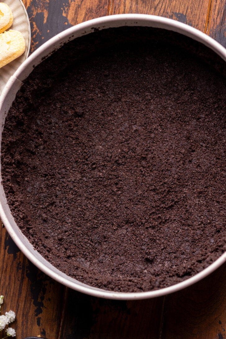 Oreo crust in a pan.