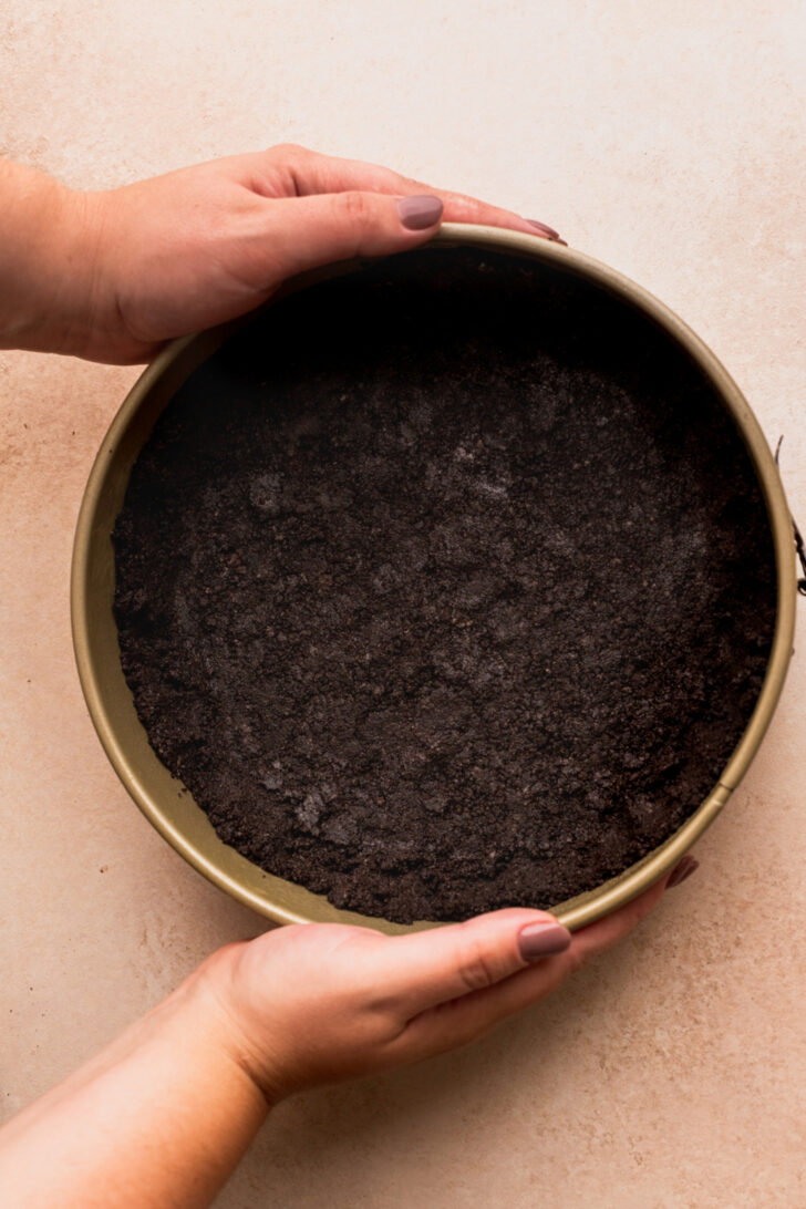 Oreo crust in a pan.