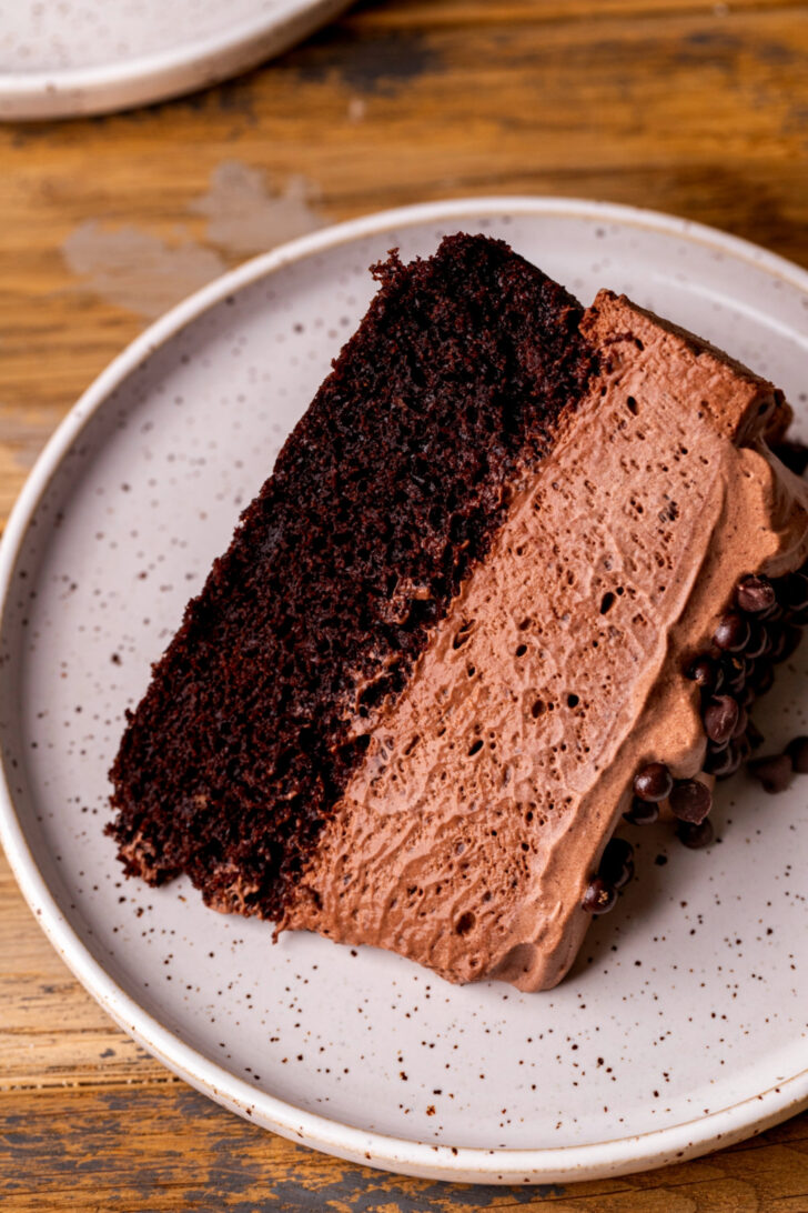 One slice on chocolate mousse cake on a plate.