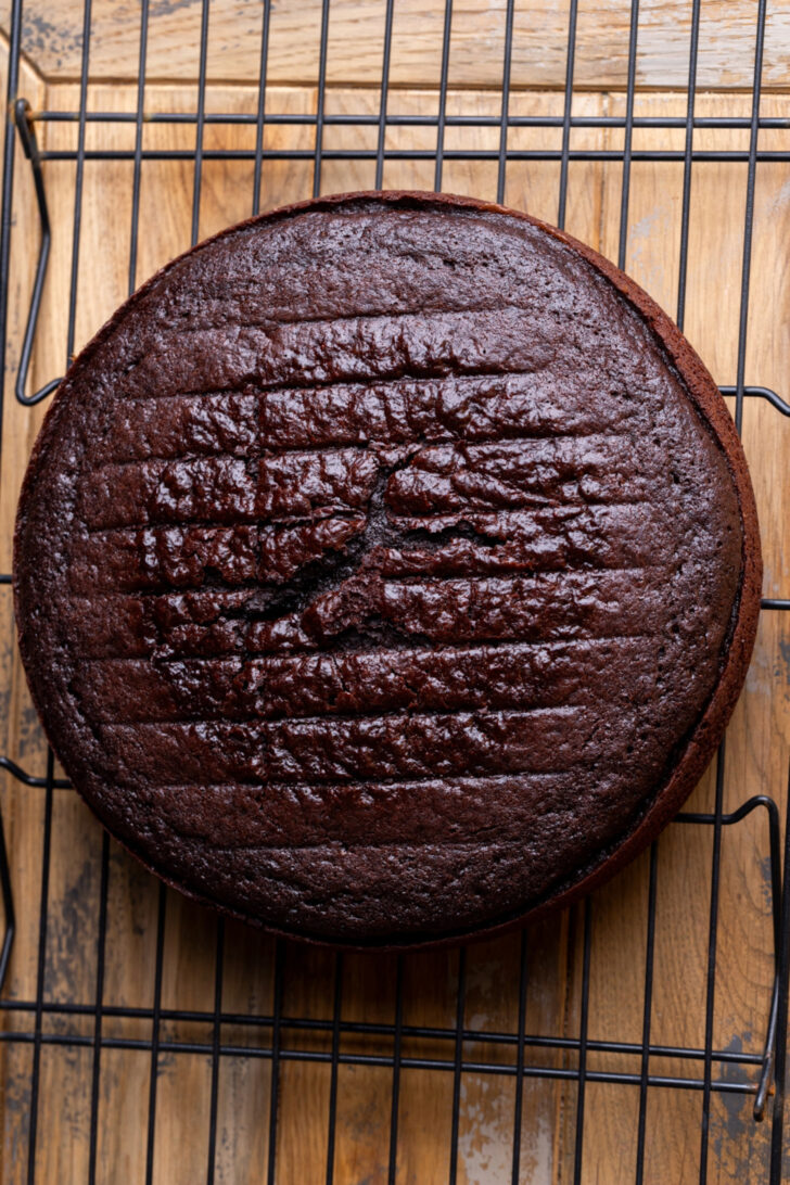Chocolate cake on a wire rack.