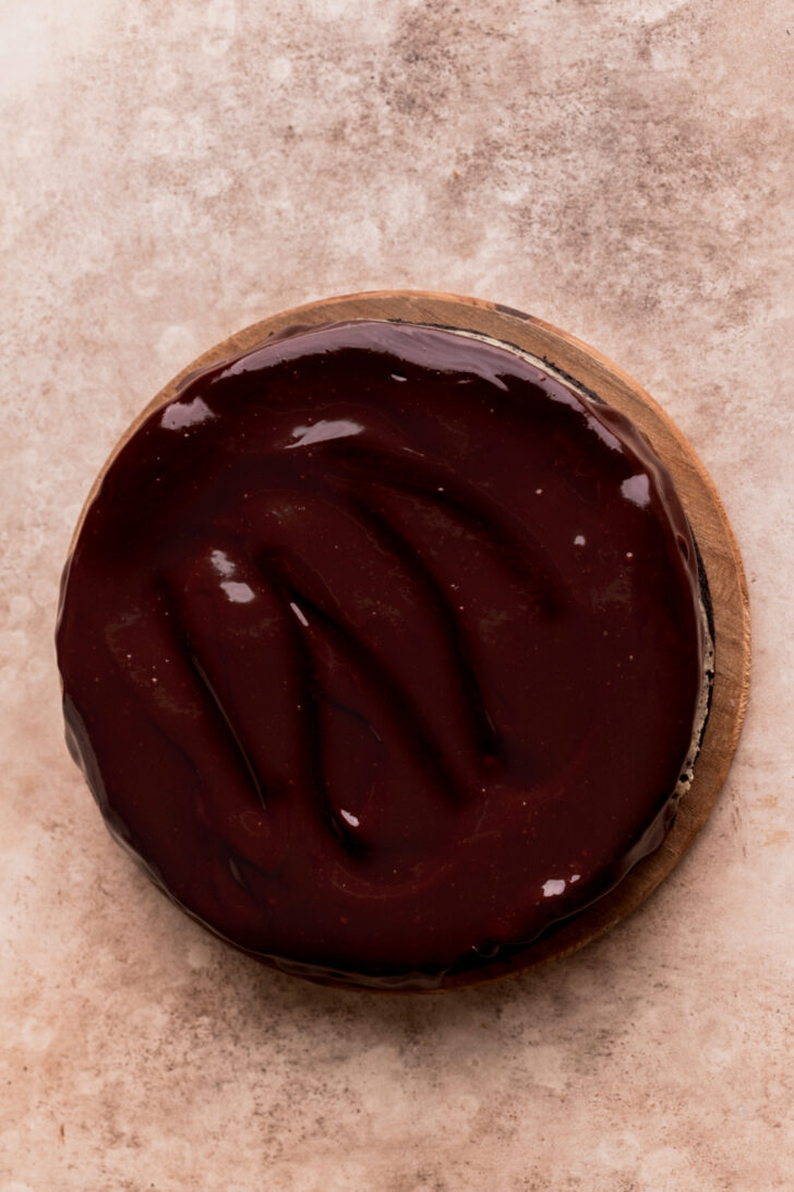 Chocolate ganache on top of cheesecake.