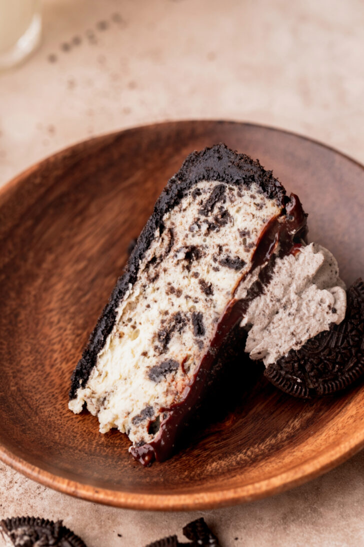 One slice of cheesecake on a plate.