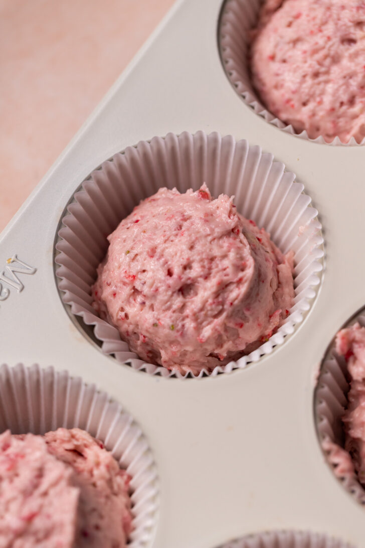 Cake batter in a cupcake pan.