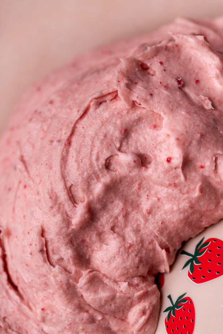 Close up of strawberry cream cheese frosting.