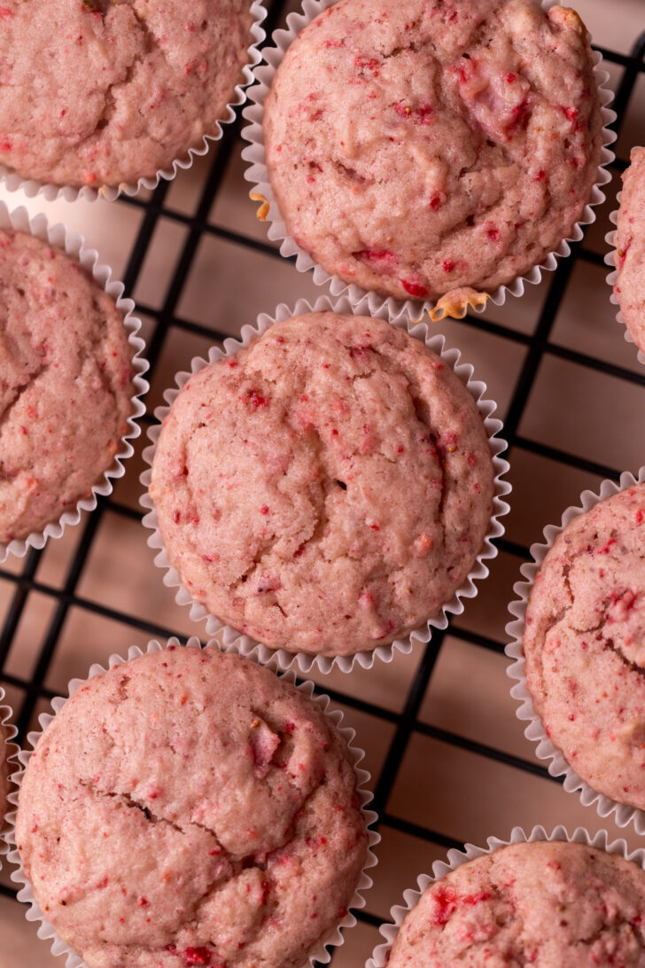 Baked cupcakes on a wire rack.
