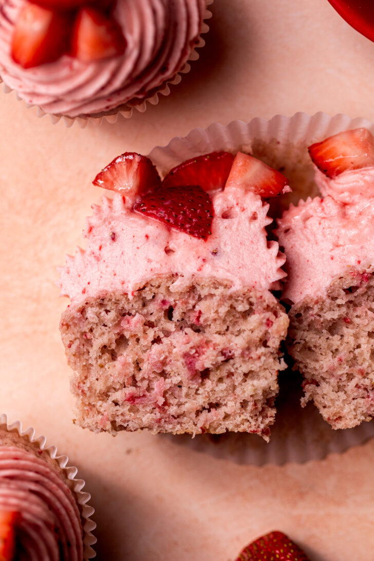 One strawberry cupcake split in half.