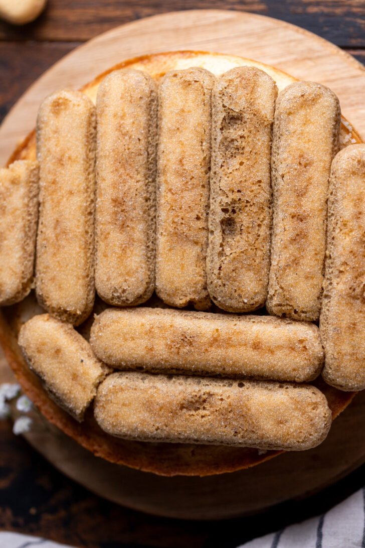 Soaked ladyfingers on top of cake.