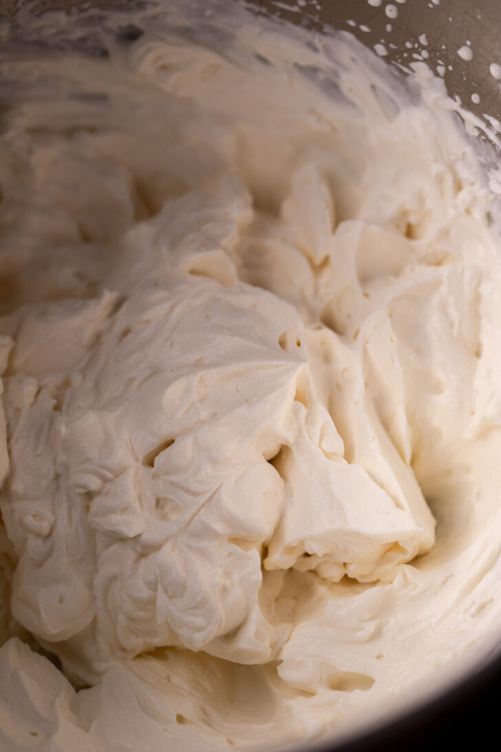 Mascarpone cream in a metal bowl.