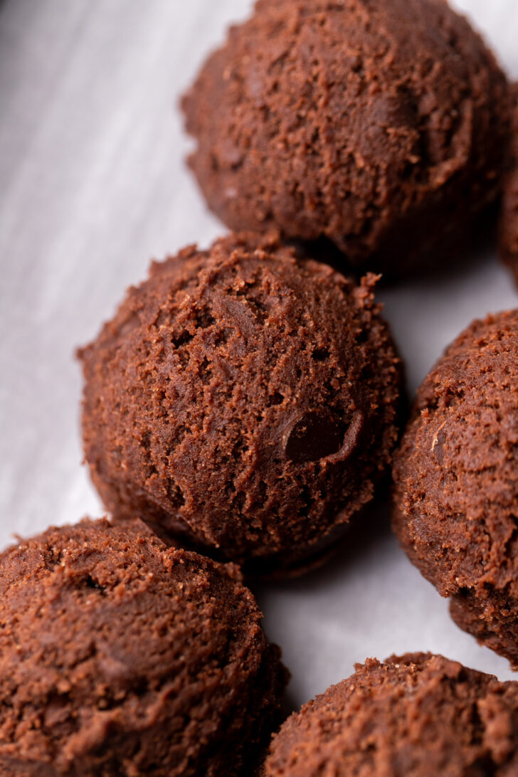 Cookie dough ball on a cookie sheet.