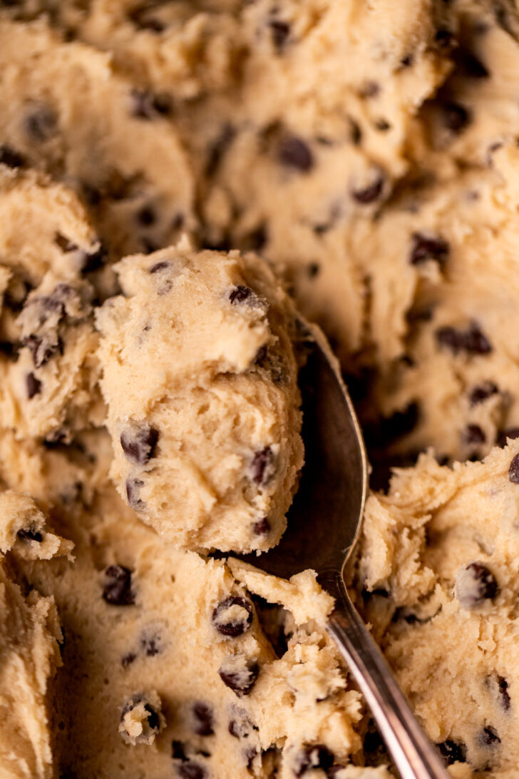 Spoon with a bite of dough on it.