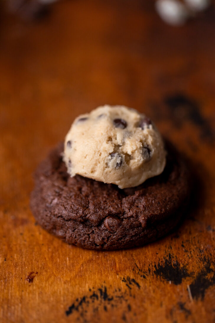Cookie dough ball on top of cookie.