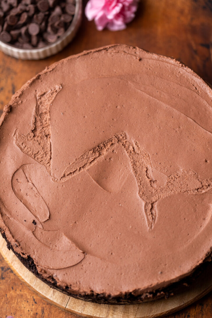 Chilled cheesecake on a wood board.